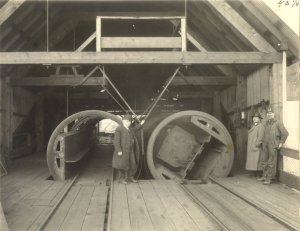 Revolving coal tipples used at the Cannon mine, Franklin, designed by R.R. Sterling, who appears in the center of the picture. These machines were built at the Seattle shops of the Pacific Coast Company.